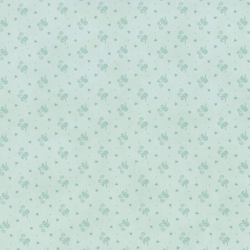 Light blue fabric with a subtle pattern of small flowers and dots.