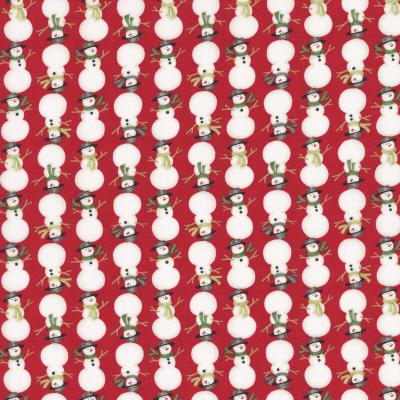 Berry red fabric with alternating rows of right-side-up and upside-down snowmen in scarves and hats.