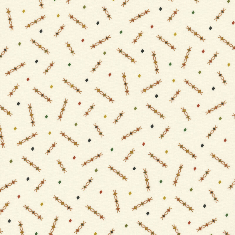 Patterned fabric with a cream background featuring scattered geometric shapes in warm colors.