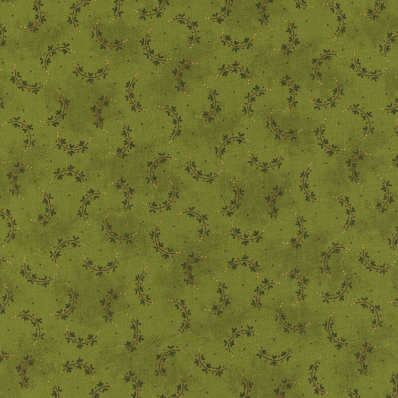 Green fabric with a repeating pattern of curved vines and small dots.