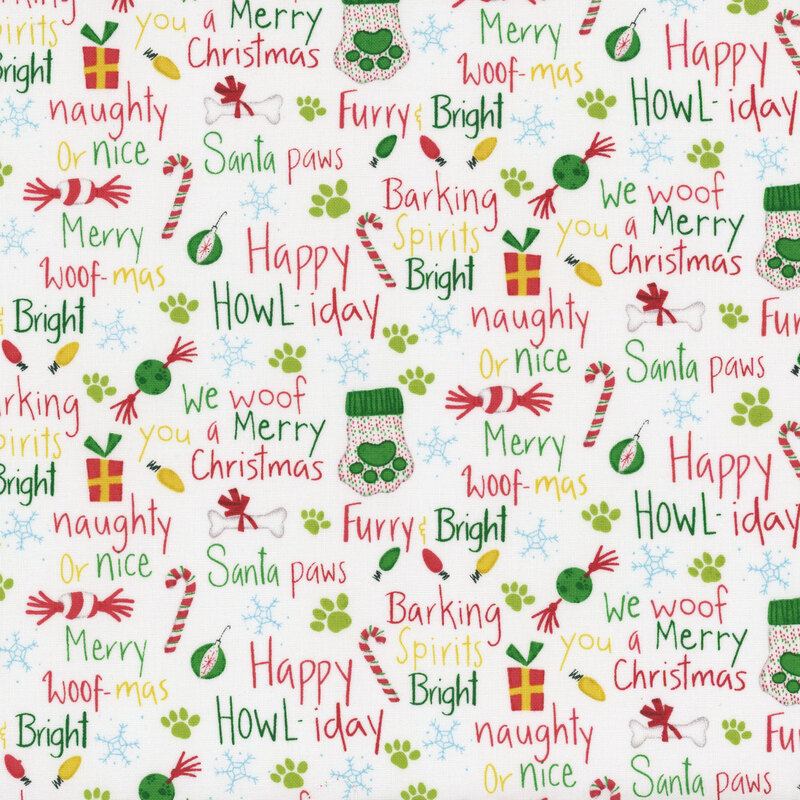 White holiday themed fabric featuring cheerful text, paw prints, and festive icons like gifts and candy canes.