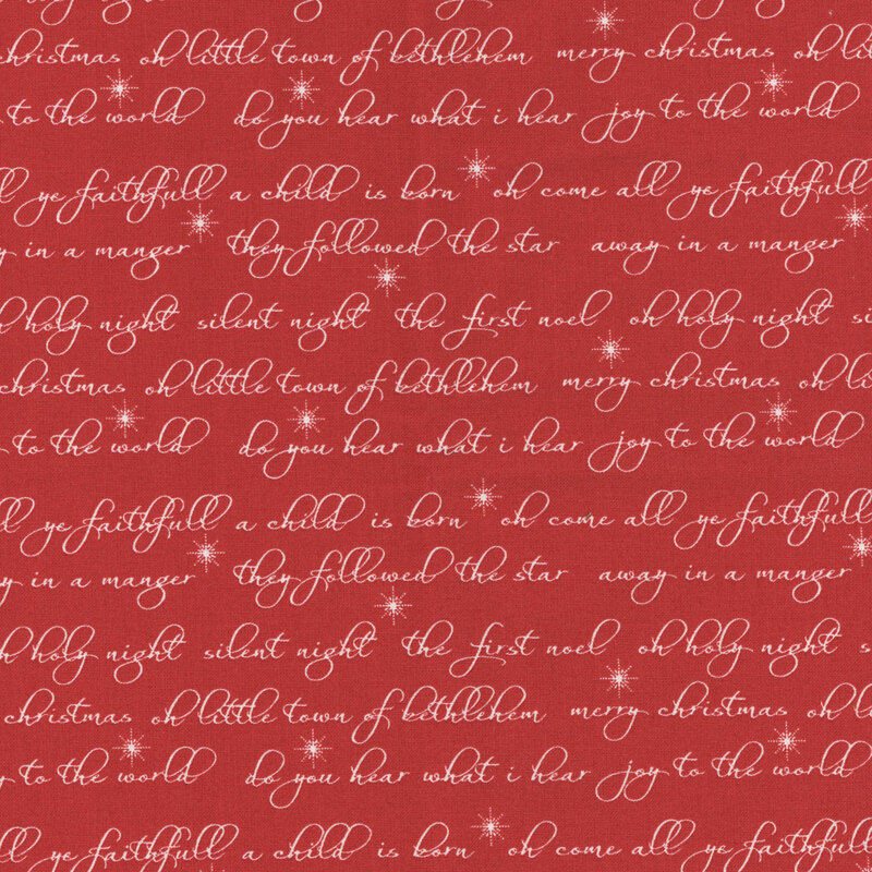 Red fabric with rows of cursive holiday phrases in cream