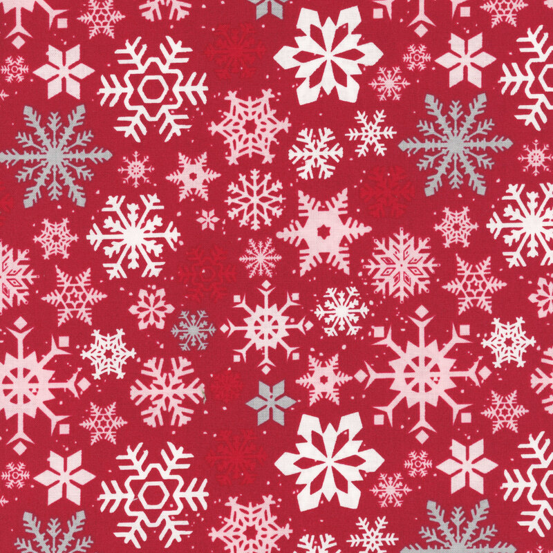Red background adorned with various white and light pink snowflakes of different sizes and designs.