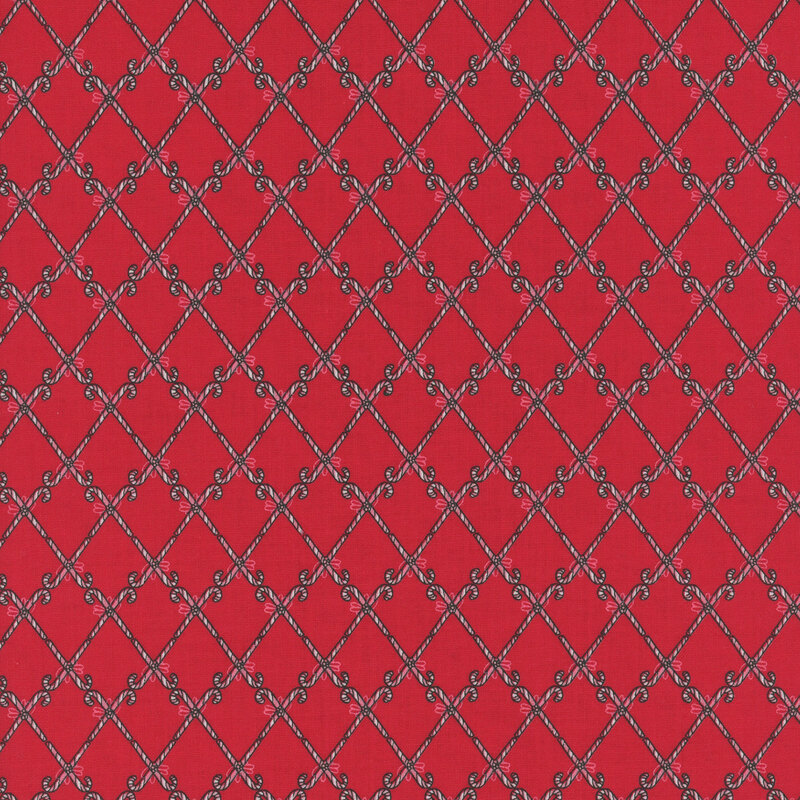 Red background with a white diamond pattern featuring numerous cane shapes.