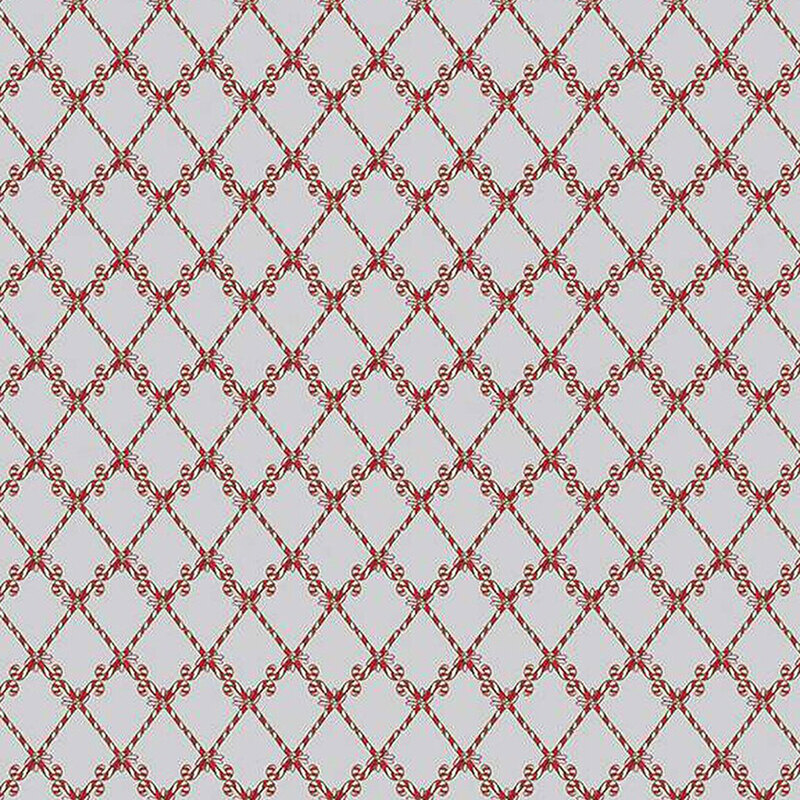 Textile pattern featuring a diamond grid design with red floral motifs on a light background.