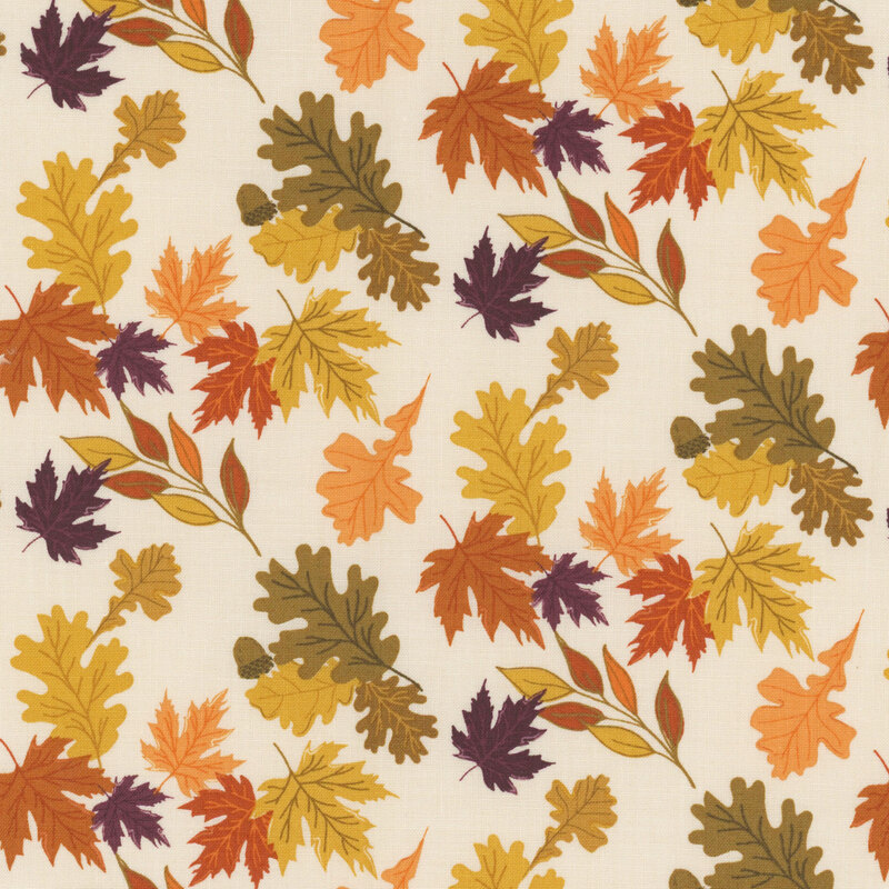 Fabric with various autumn leaves in warm colors on a beige background.