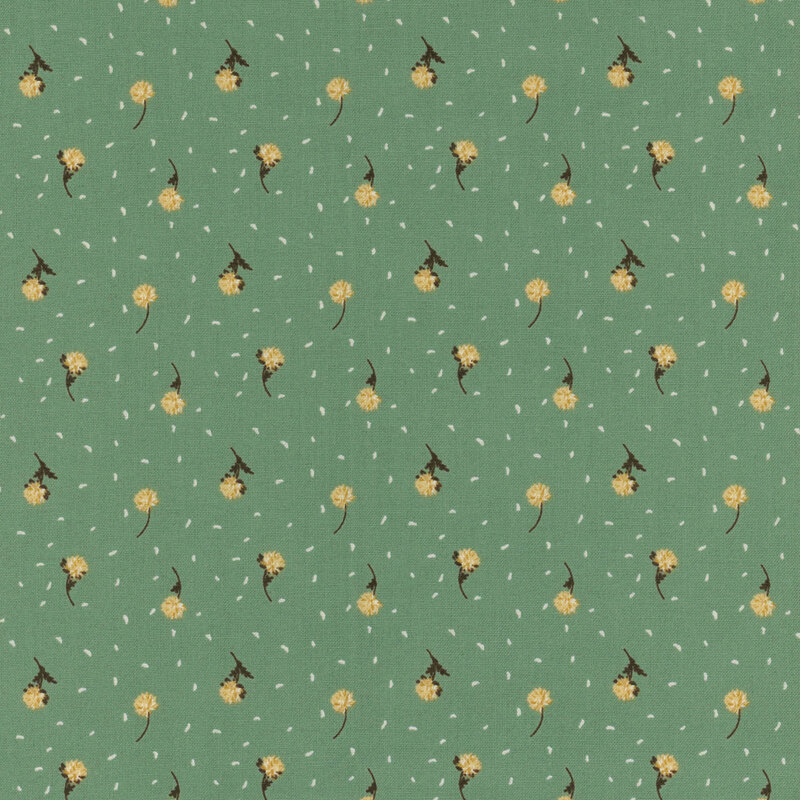 Fabric with a repeating floral pattern with small yellow flowers on a green background.