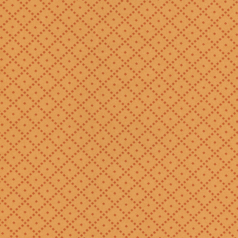 Fabric featuring a tonal orange background with a diamond pattern and small light-colored dots.
