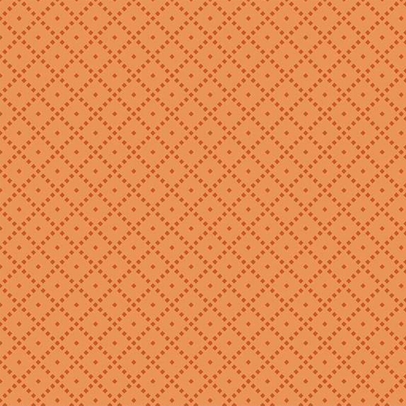 Fabric featuring a tonal orange background with a diamond pattern and small light-colored dots.