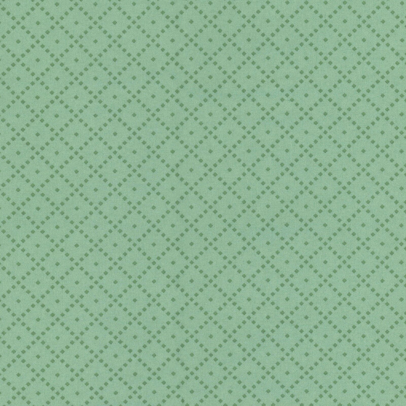 Fabric featuring a tonal teal background with a diamond pattern and small light-colored dots.