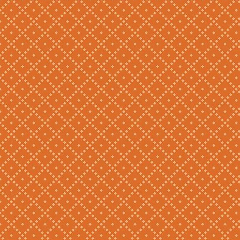 Fabric featuring an orange background with a diamond pattern and small light-colored dots.