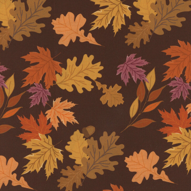 Fabric with colorful autumn leaves and acorns on a dark brown background.