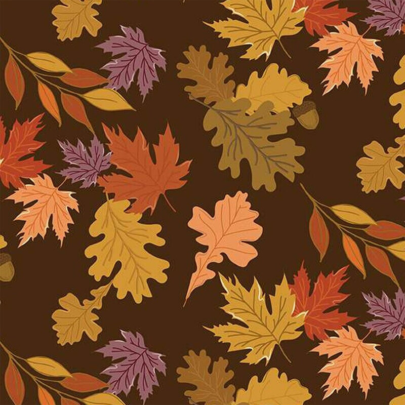 Fabric with colorful autumn leaves and acorns on a dark brown background.