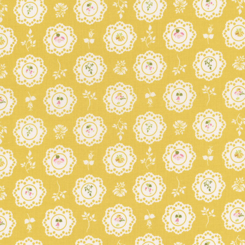 Bright yellow fabric with large white scalloped floral motifs