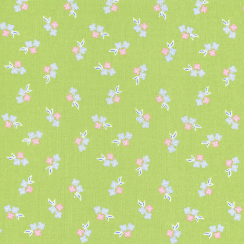 Bright green fabric with a calico pattern of pink and blue florals