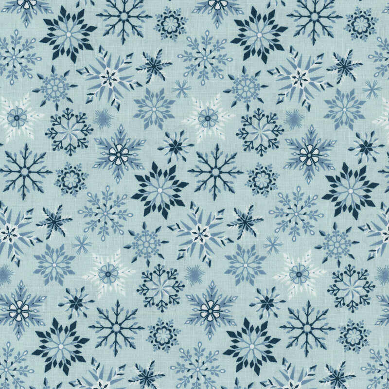 Light aqua fabric featuring various snowflakes in shades of blue.