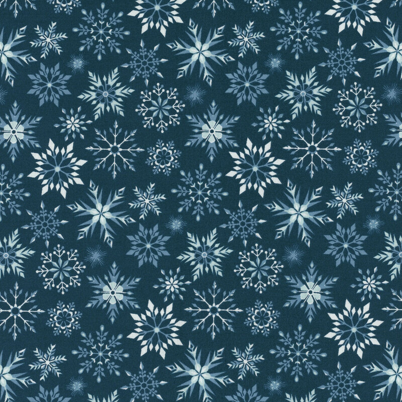 Dark teal fabric featuring various snowflakes in shades of blue.