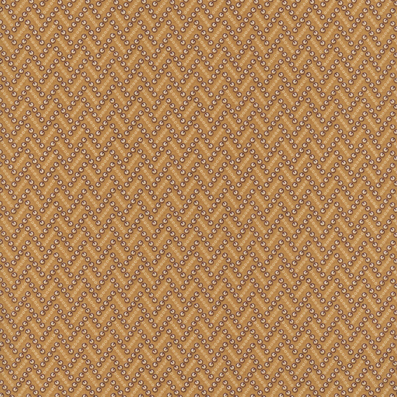 A warm brown fabric with dotted zigzag lines made up of abstract shapes.