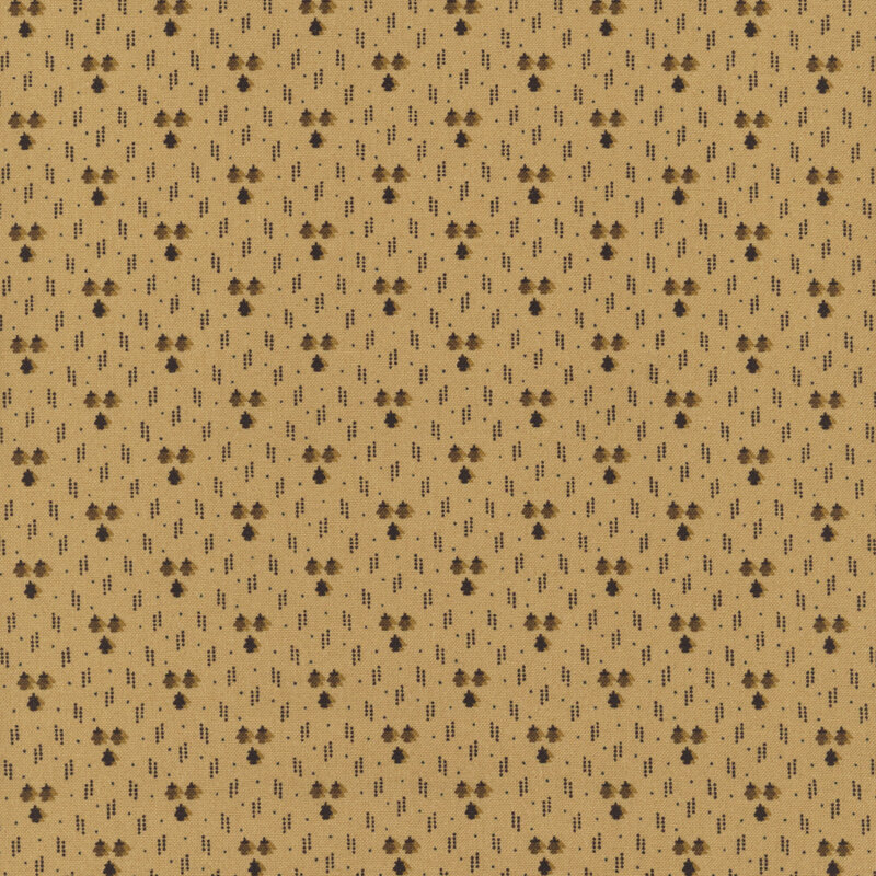 A tan fabric with small red dots, dotted lines, and tiny trees.