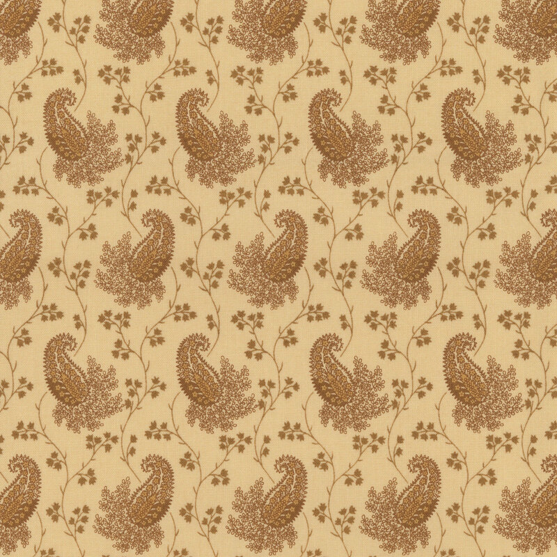 A light tan fabric with thin vines and clusters of flowers surrounding floral paisley designs.