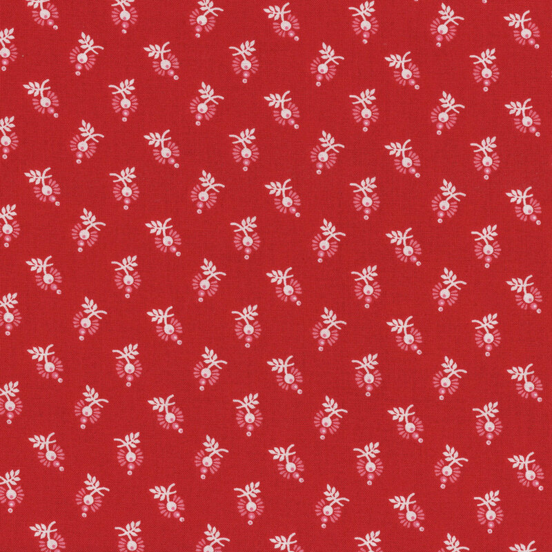 Red fabric covered with a repetitive floral pattern in white and light green.