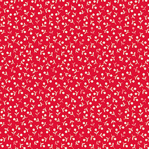 Red fabric patterned with small white flowers and green leaves.