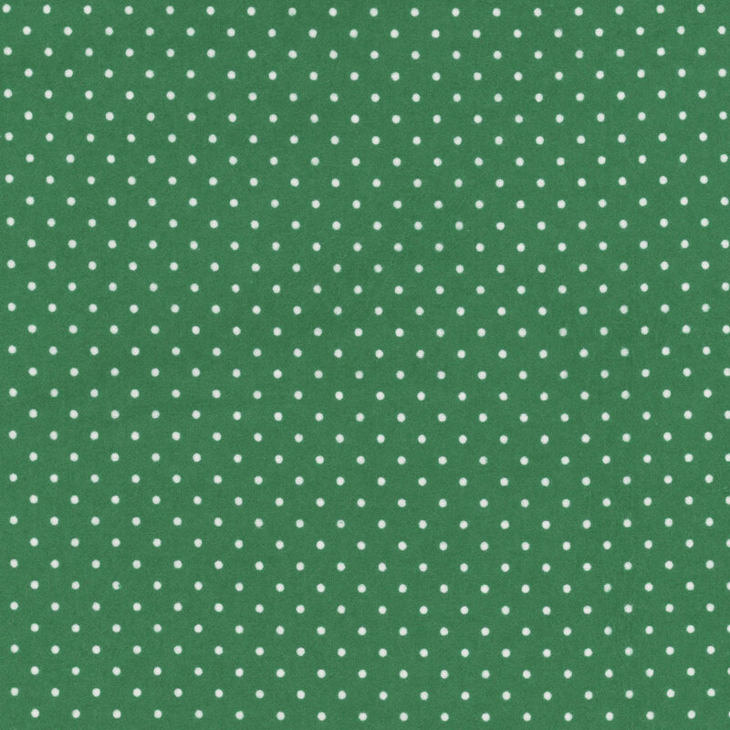 Dark green fabric featuring small white polka dots throughout