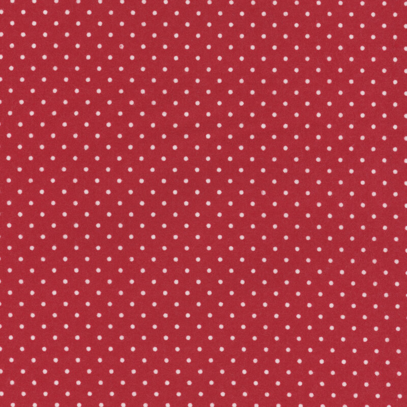 Red fabric featuring small white polka dots throughout