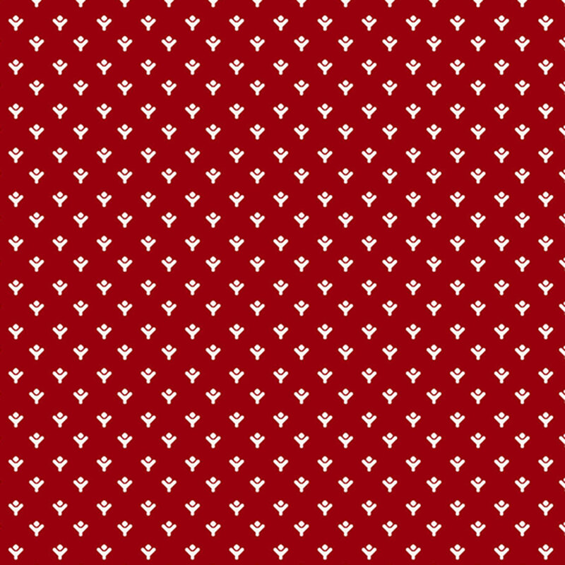 Red fabric with a repeating pattern of small white floral motifs.