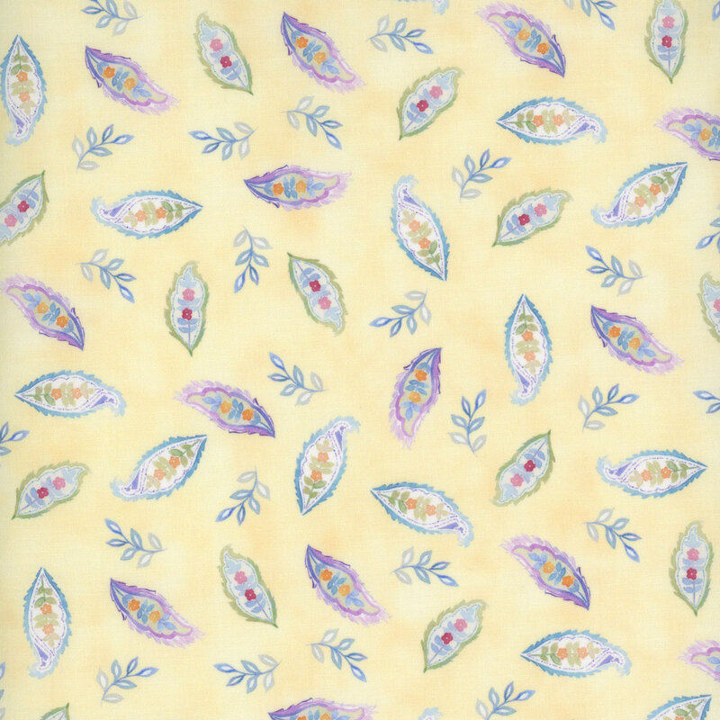 Light yellow background with colorful floral leaf patterns and small green leaves.