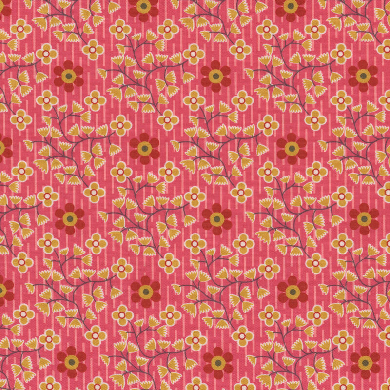 Floral fabric pattern with red and white flowers on a pink background, interspersed with yellow leaves.