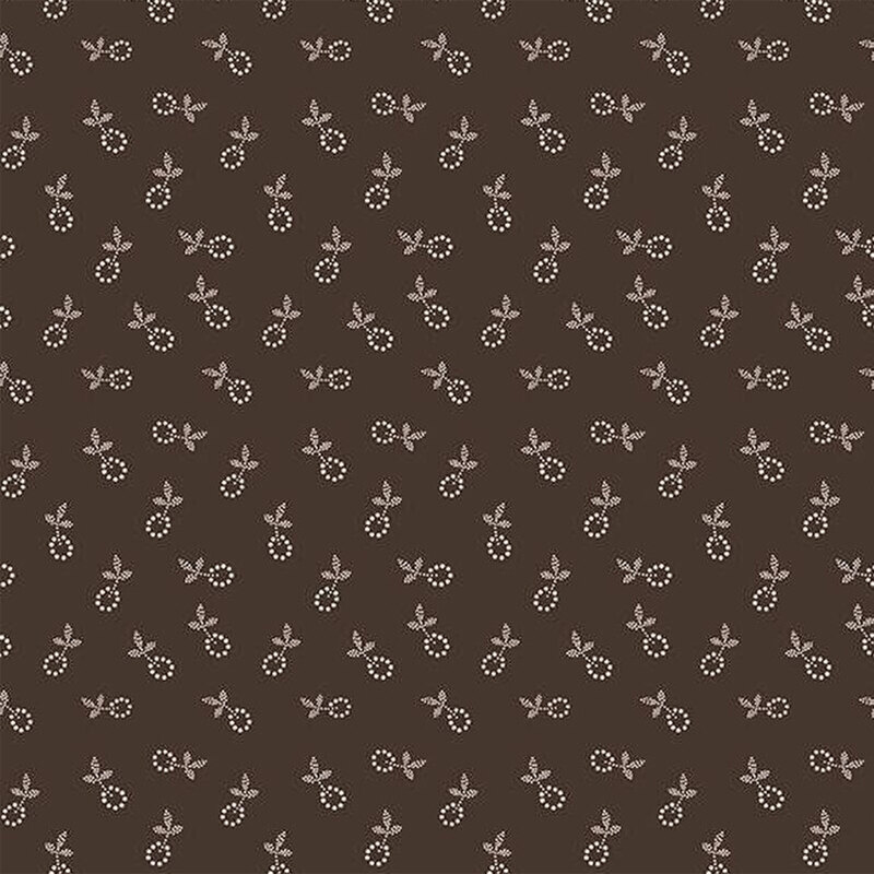 Fabric featuring a calico pattern of small off white flower blossoms on a dark brown background