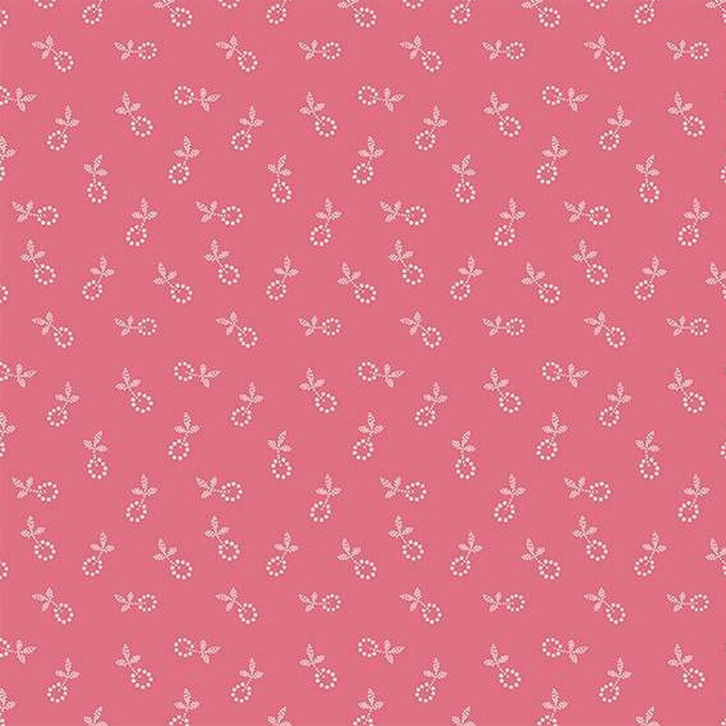 Fabric featuring a calico pattern of small white flower blossoms on a pink background.