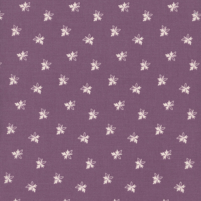 Floral fabric with a plum purple background, featuring small, white, scattered leaves.