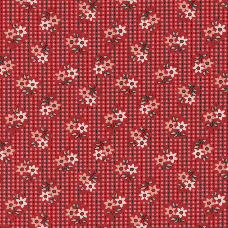 Red fabric with a repeated floral pattern featuring white and pink flowers and green leaves.