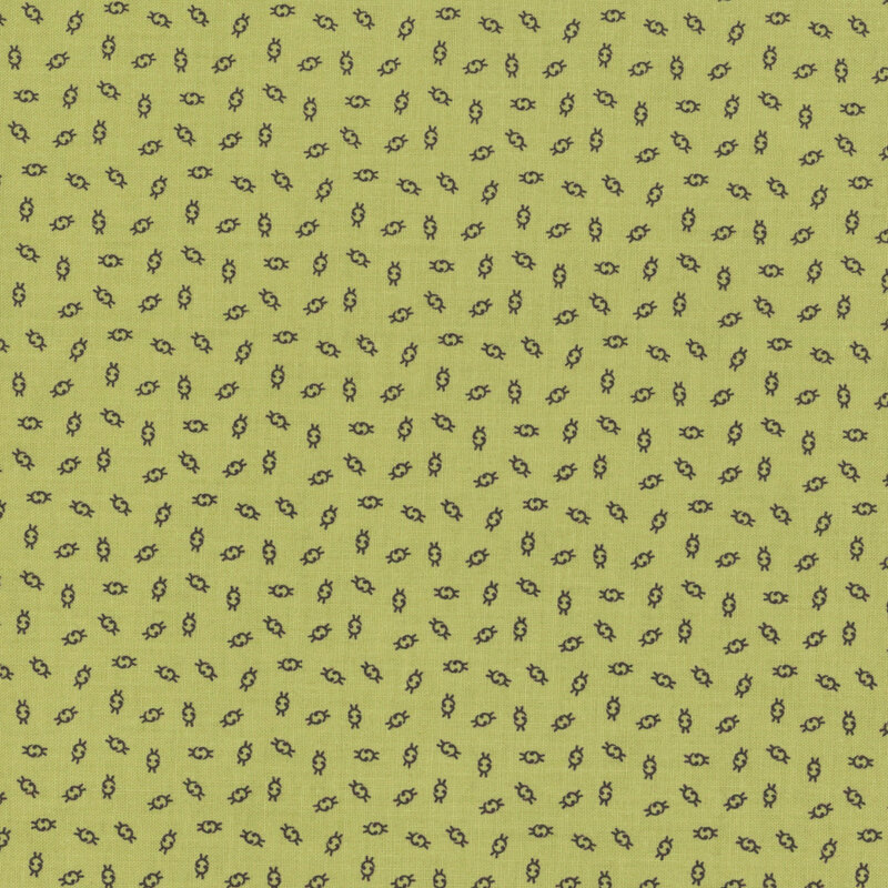 Fabric with a green background featuring small, repeated ditsy illustrations.