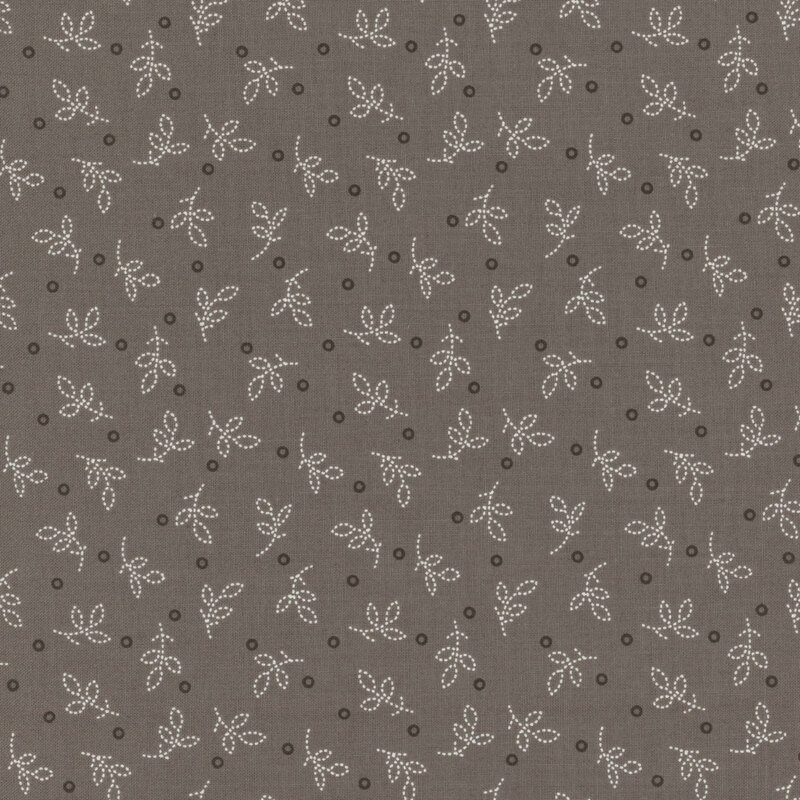 Gray brown fabric featuring scattered white leaves and small dark circles.