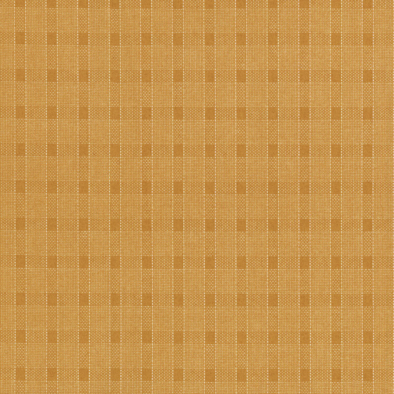 Fabric with a tan and beige plaid design with thin white lines.
