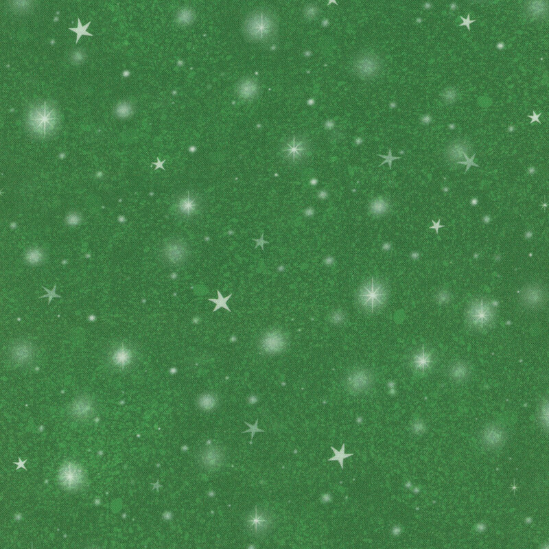 Green fabric with tossed stars and blurry circles of light on a textured background.