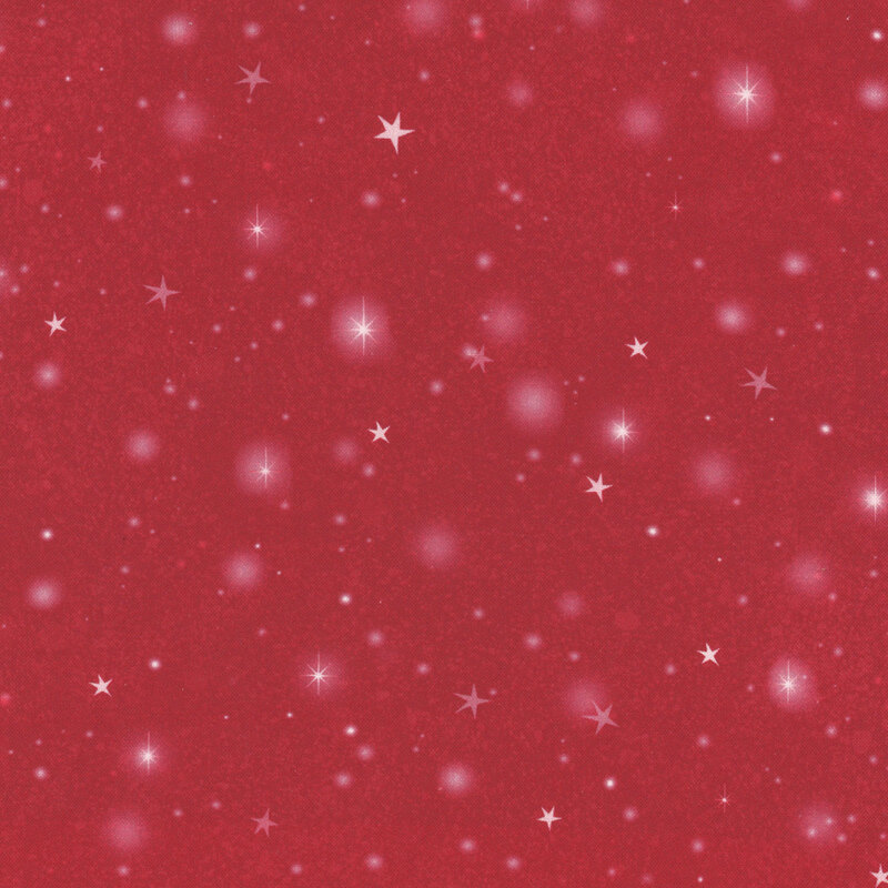 Red fabric with tossed stars and blurry circles of light on a textured background.