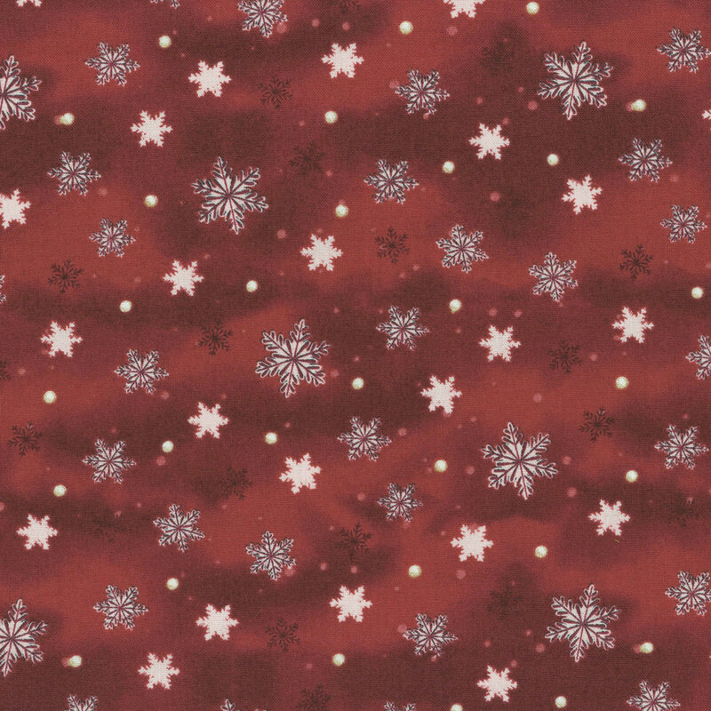 Red fabric with white snowflakes and small cream-colored dots scattered throughout.