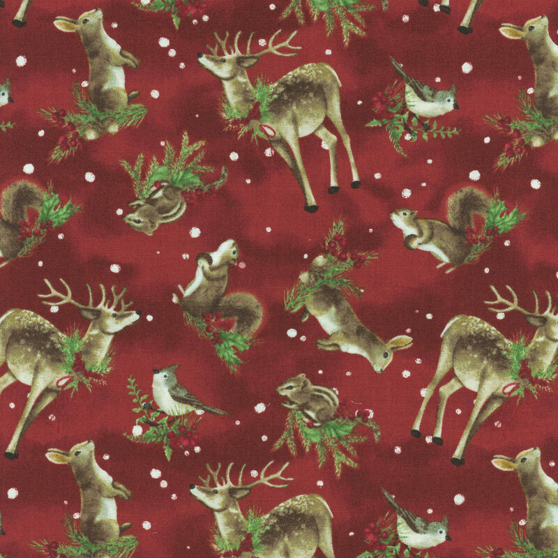 Fabric pattern featuring deer, rabbits, squirrels, and birds among foliage on a red background.