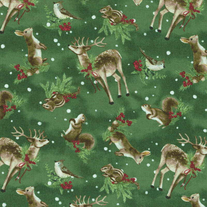 A fabric pattern featuring deer, rabbits, squirrels, and birds amid greenery and snowflakes on a forest green background.