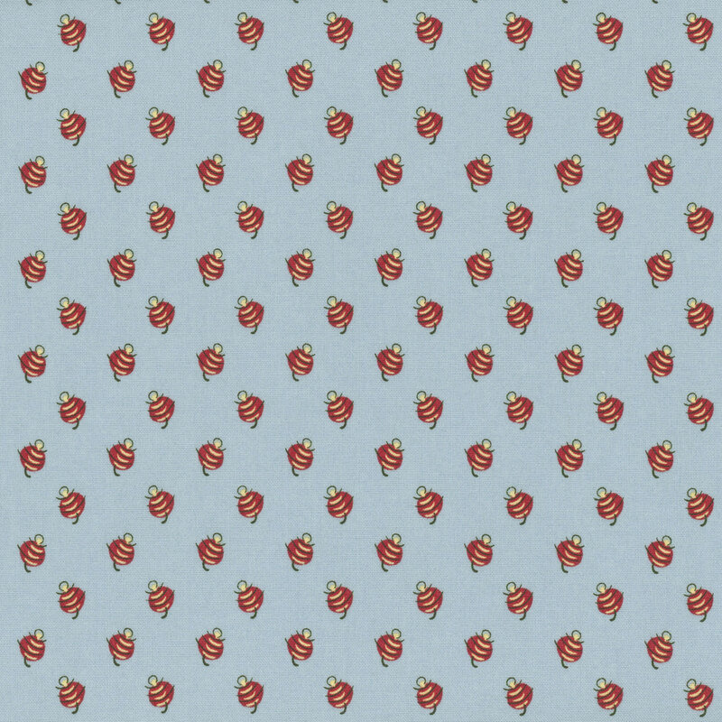 Dusty blue fabric with an abstract red and white calico print.