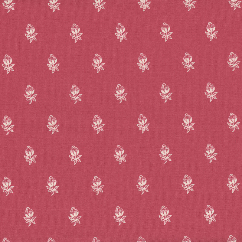 Pink fabric with ornate white flowers. 