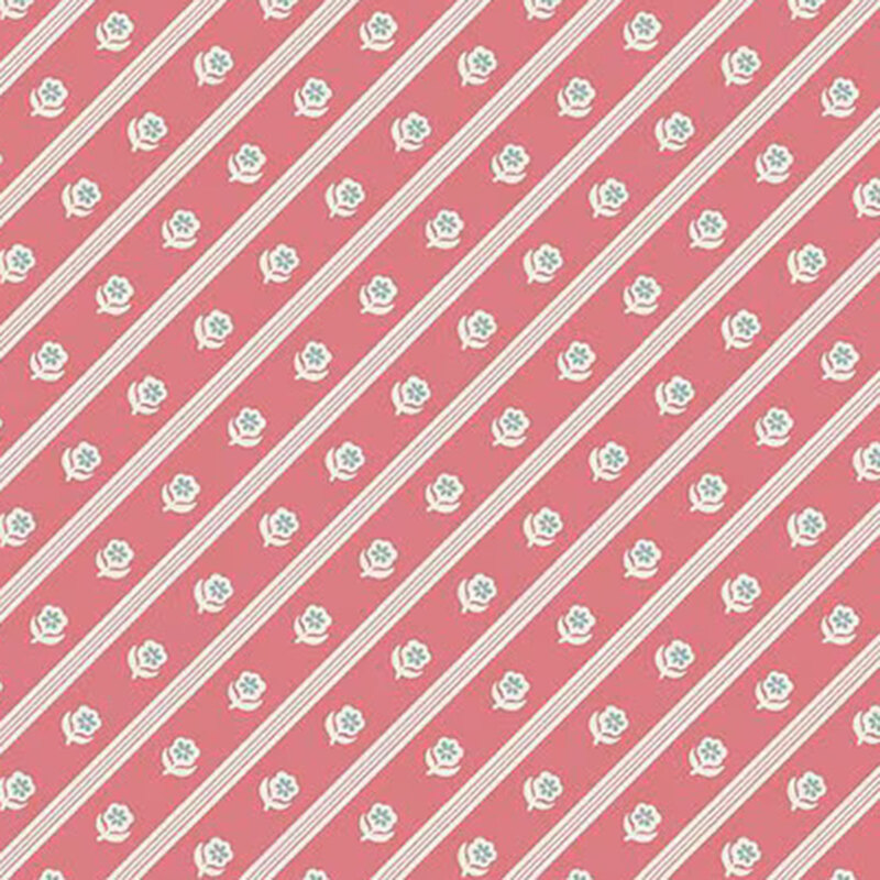 Pink fabric with white and slate blue florals in diagonal stripes.