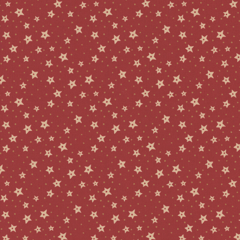 Red fabric with scattered yellow stars and small gold polka dots.