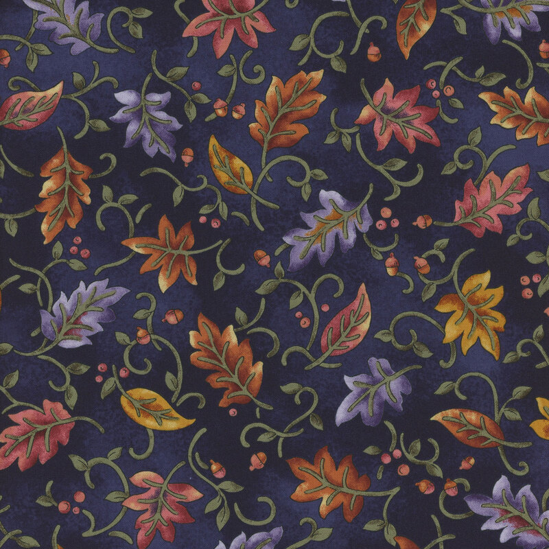 A rich blue fabric featuring a decorative pattern of colorful autumn leaves and swirls.