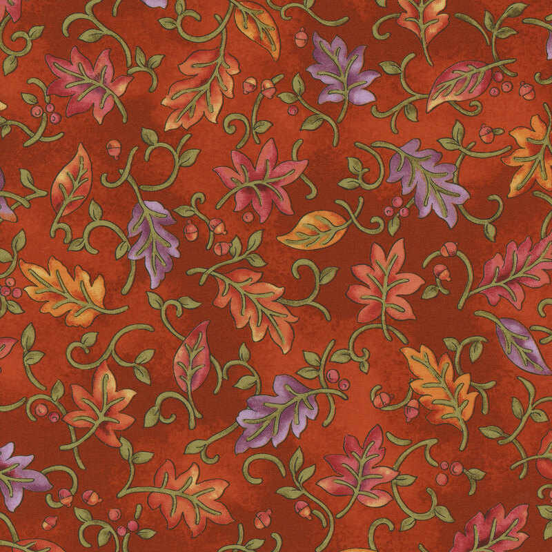 A rich orange fabric featuring a decorative pattern of colorful autumn leaves and swirls.