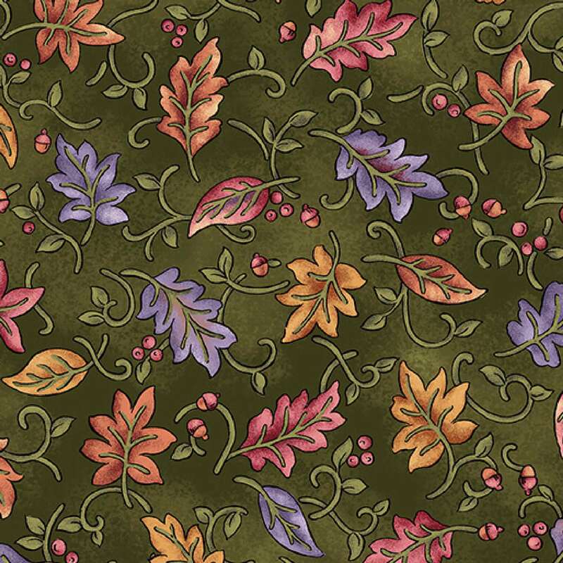 A rich green fabric featuring a decorative pattern of colorful autumn leaves and swirls.